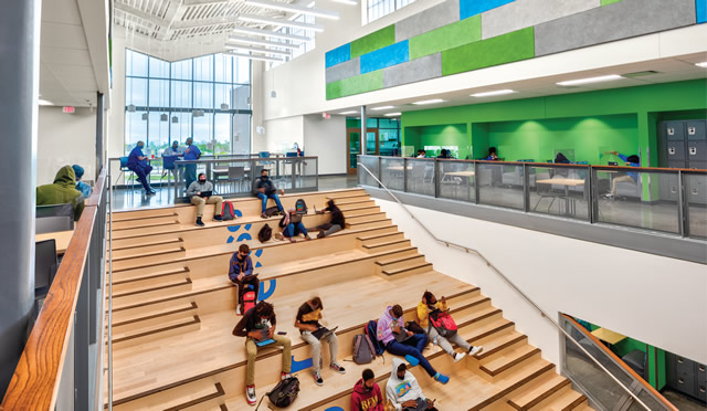 students sitting in auditorium area