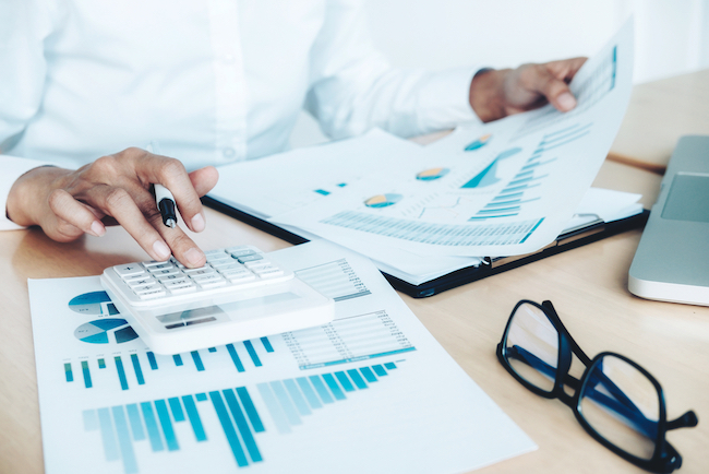 Accountant using a calculator. 